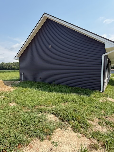 After - completed dark gray siding side view