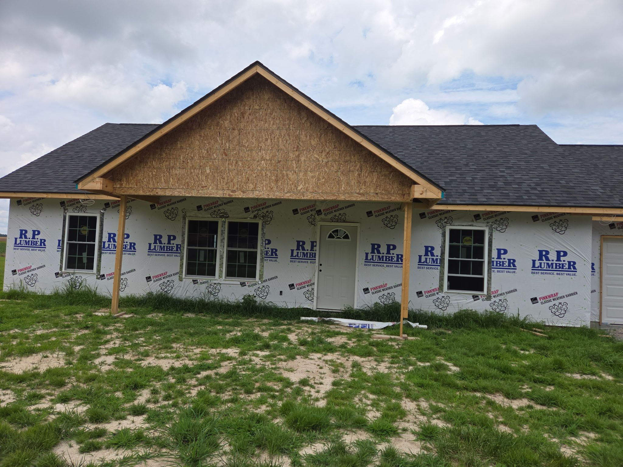 Before - house wrap front with porch